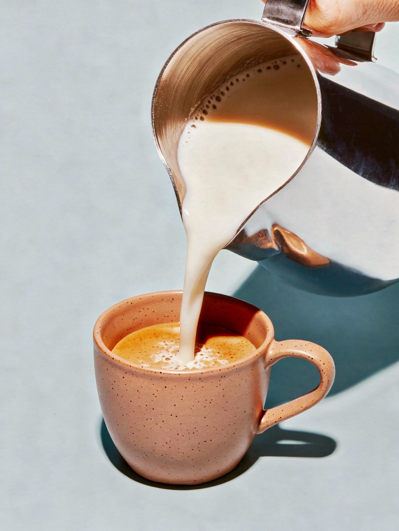 Delicious Coffee with Cream Pouring