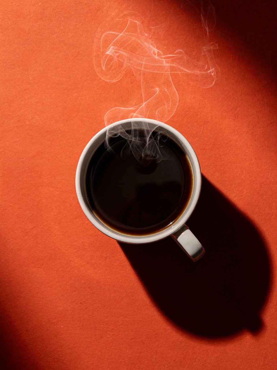 Steaming Hot Coffee in a White Mug