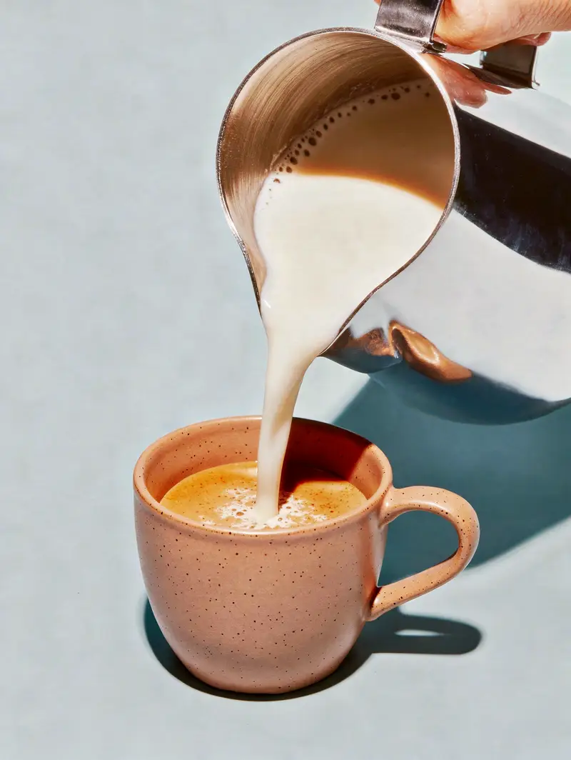 Delicious Coffee with Cream Pouring