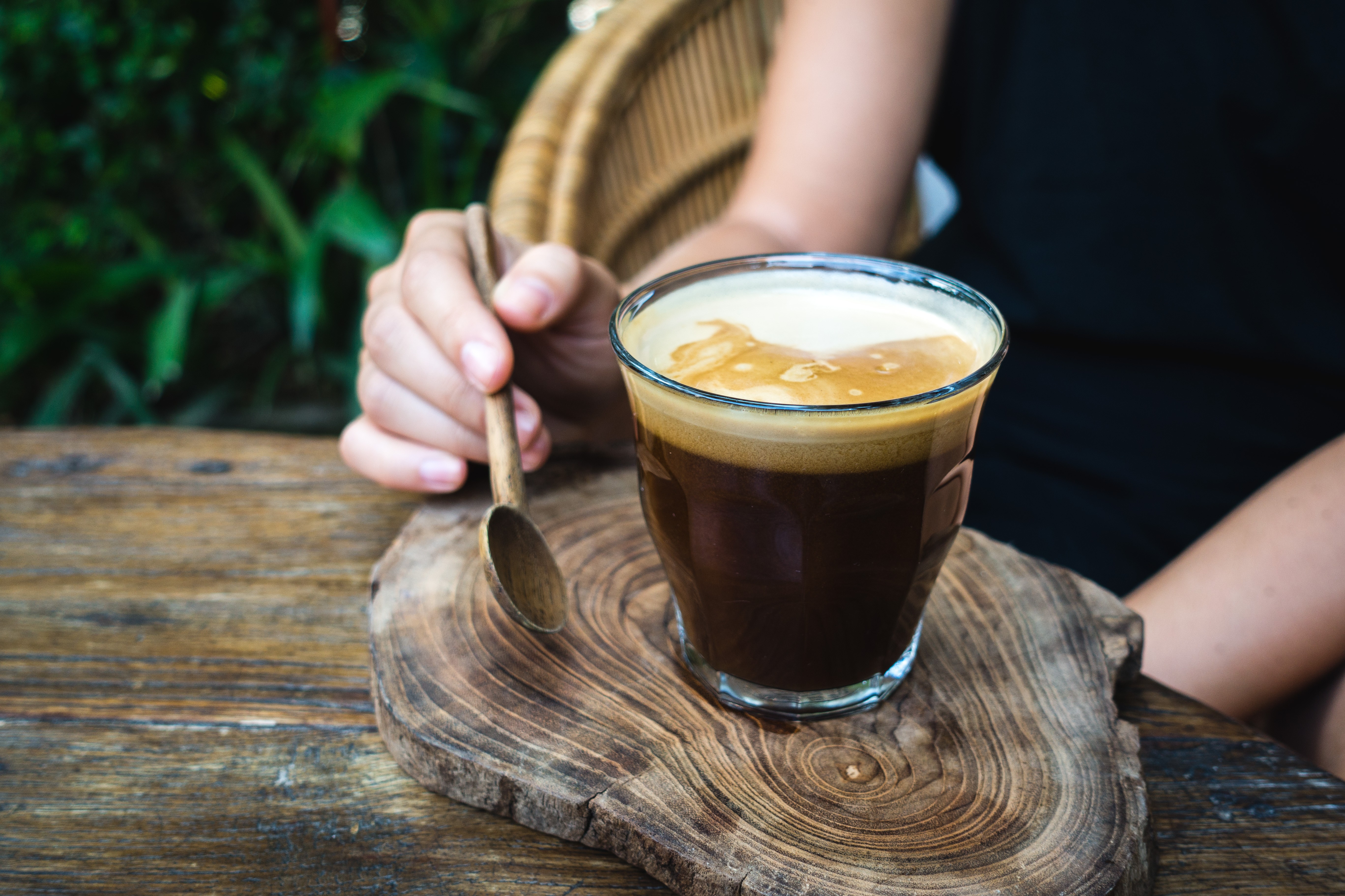 Black coffee with coconut milk foam