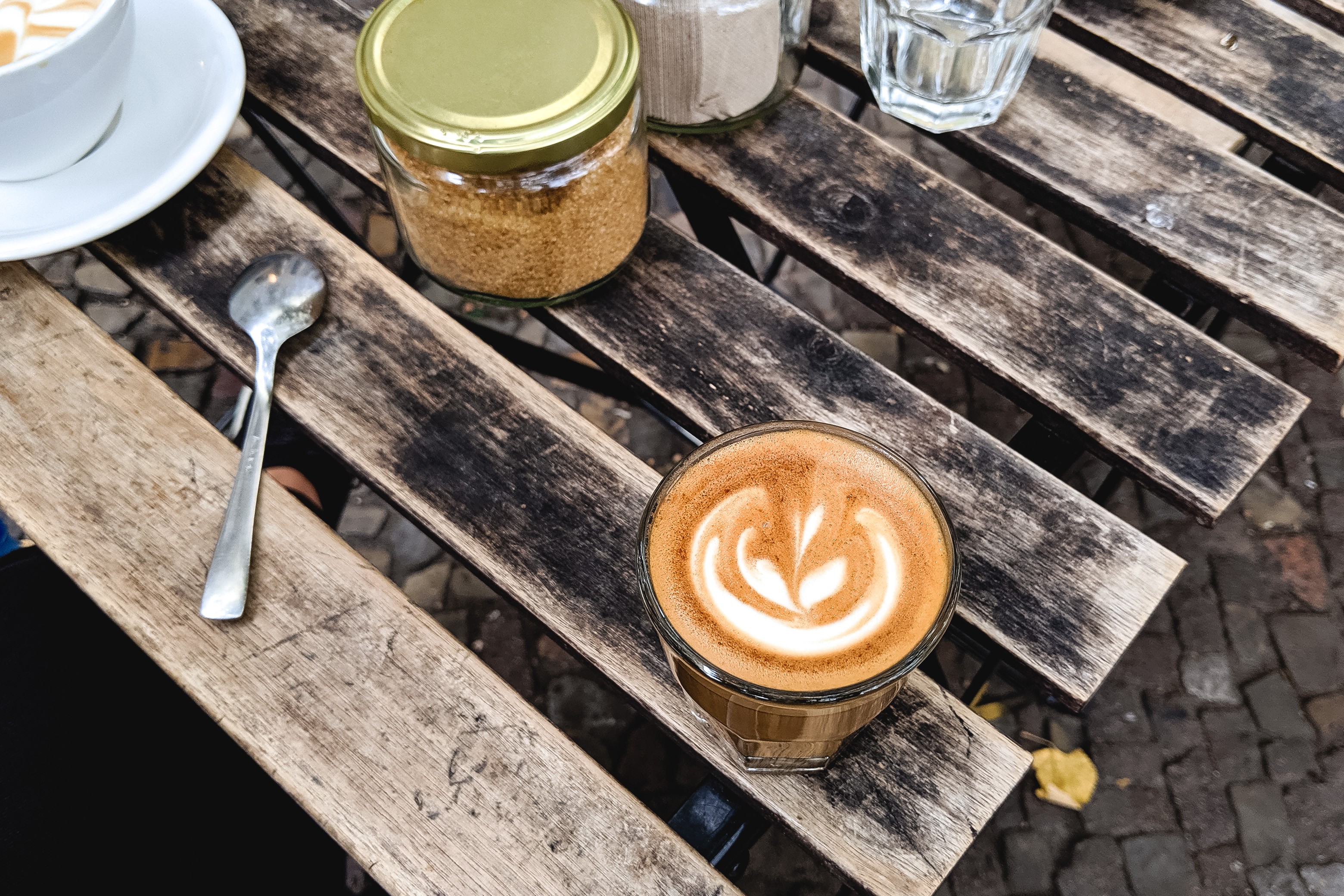 Cappuccino outside on a wooden table
