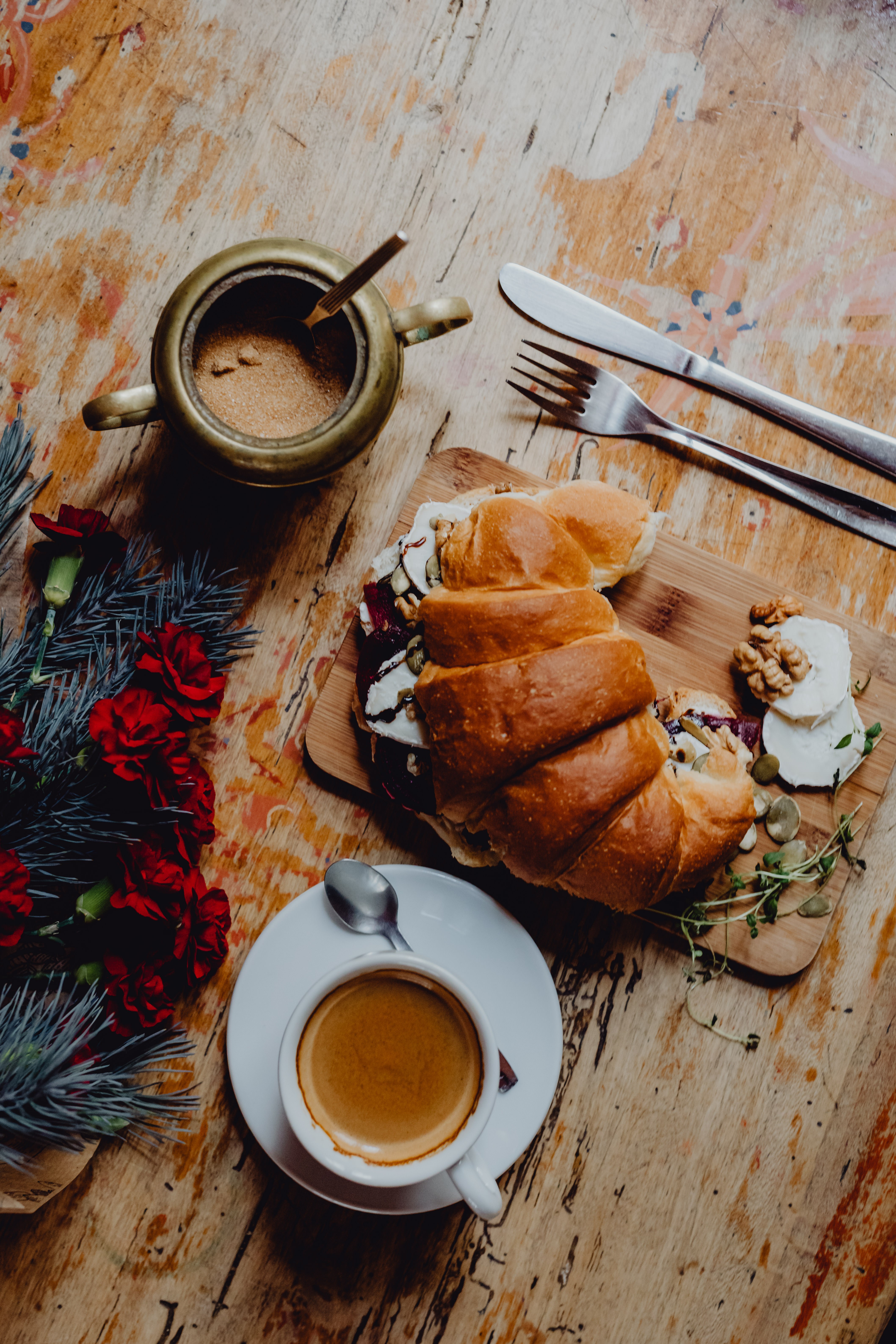 Croissant with cheese and a cup of coffee for breakfast