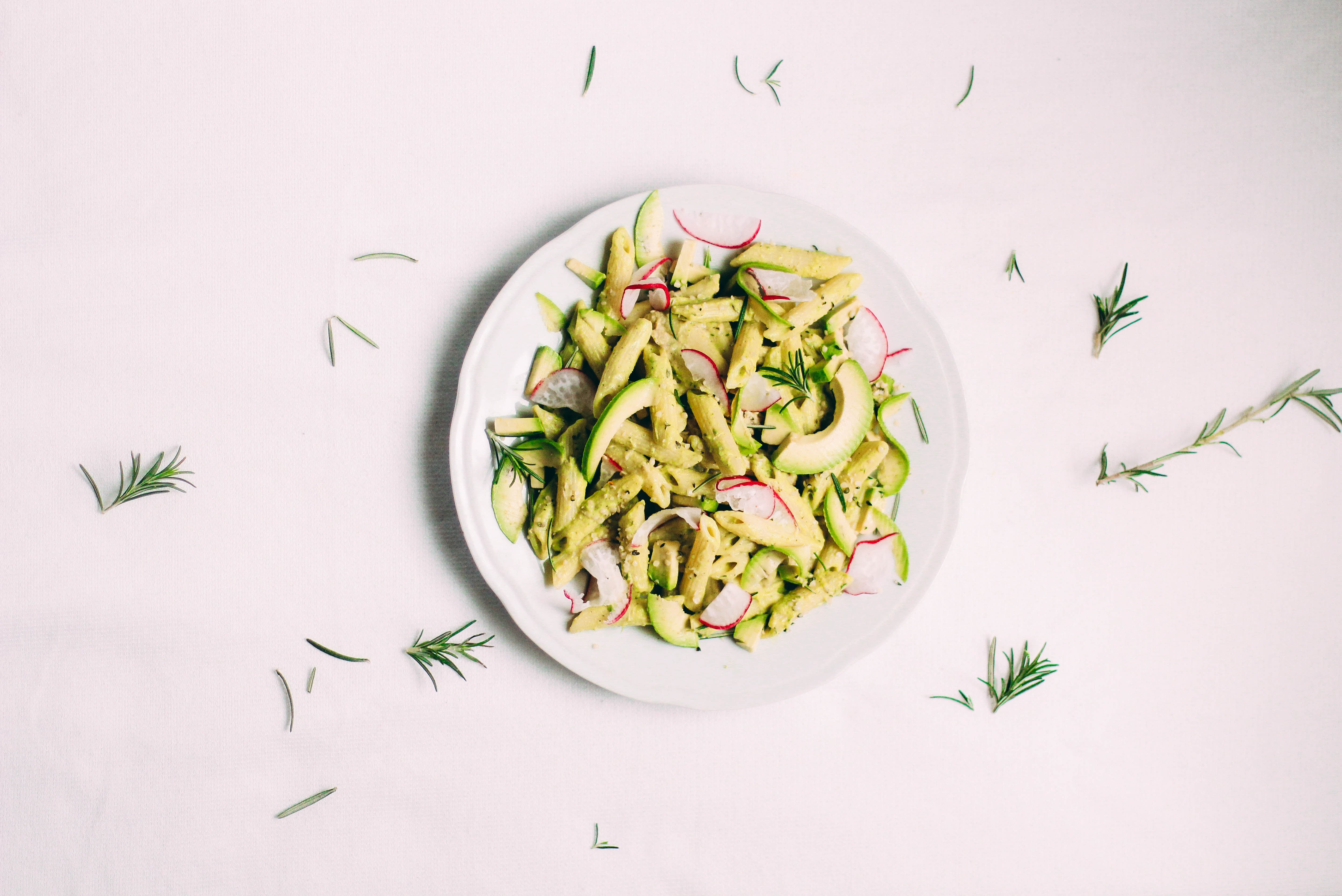 Penne with pesto, avocado and radishes