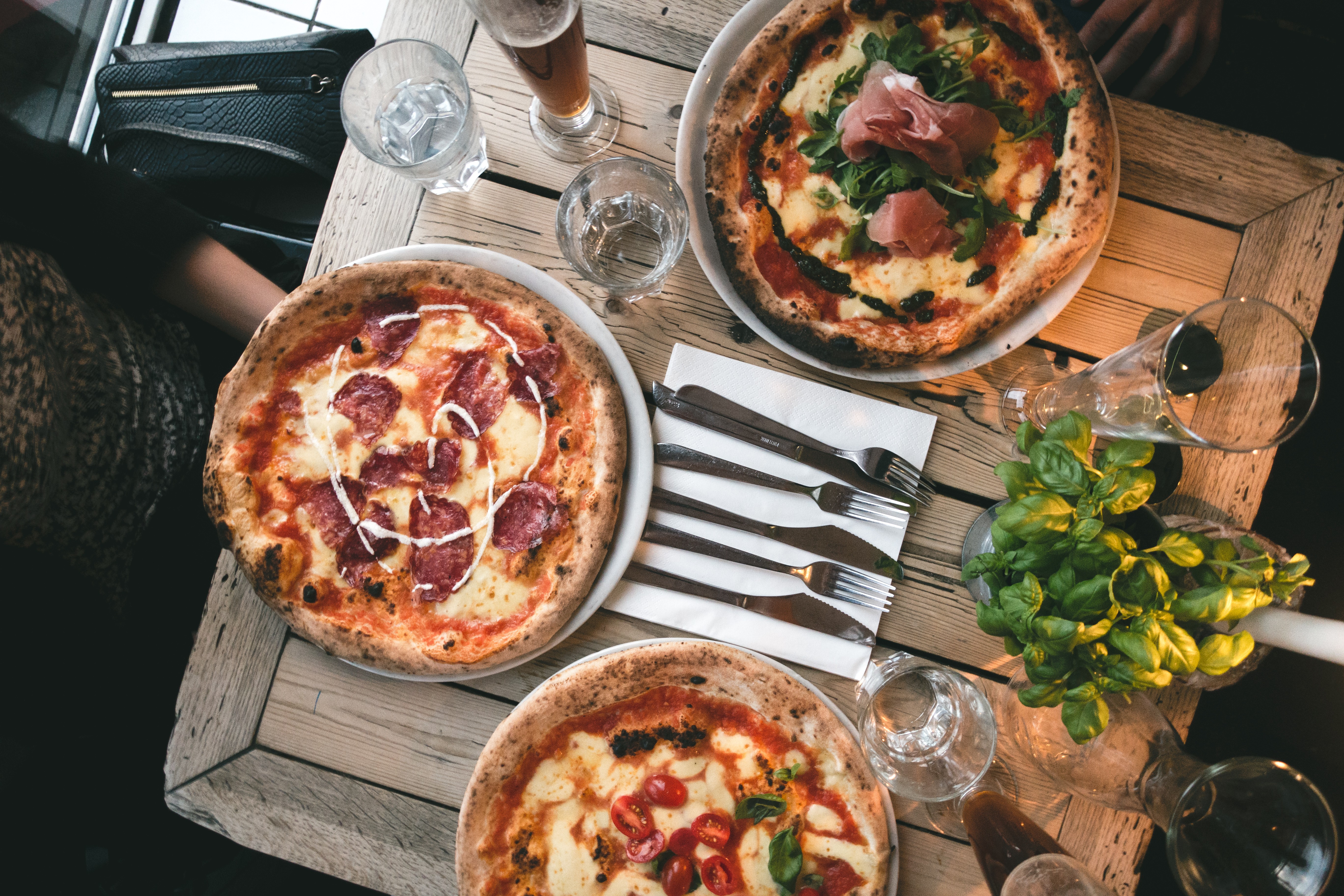 Friends having pizza in a restaurant