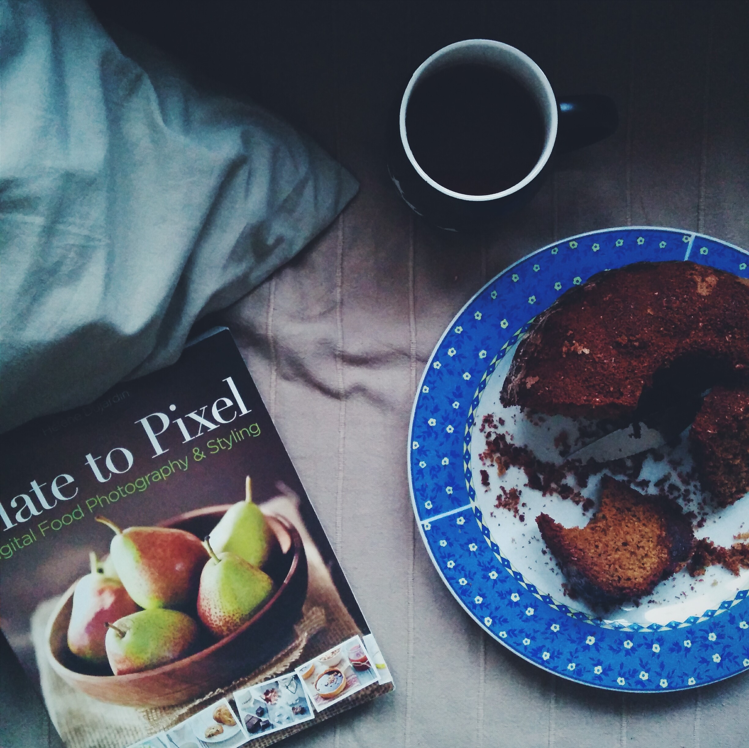 Homemade bun with tea and a book