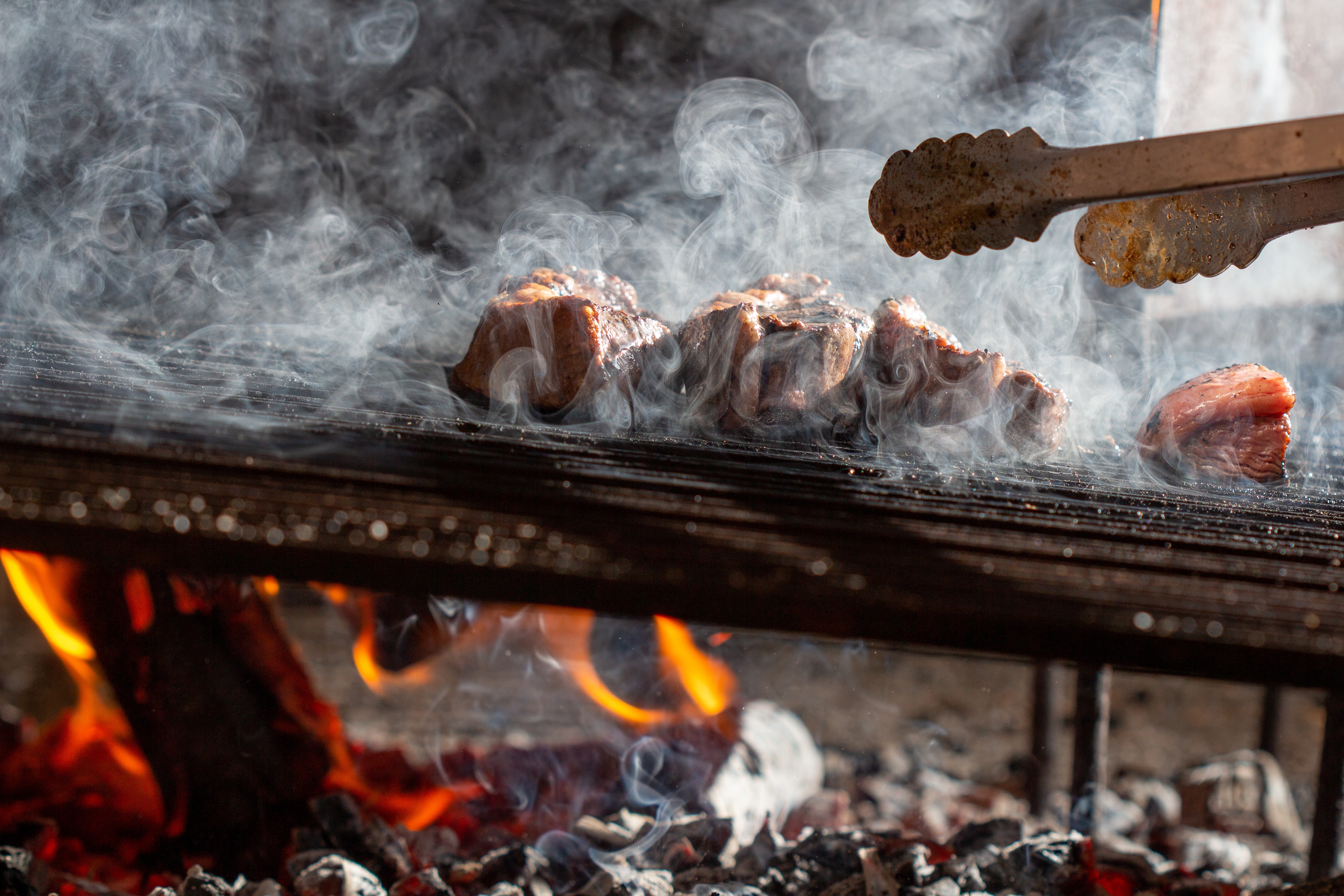 Grilling beef on charcoal