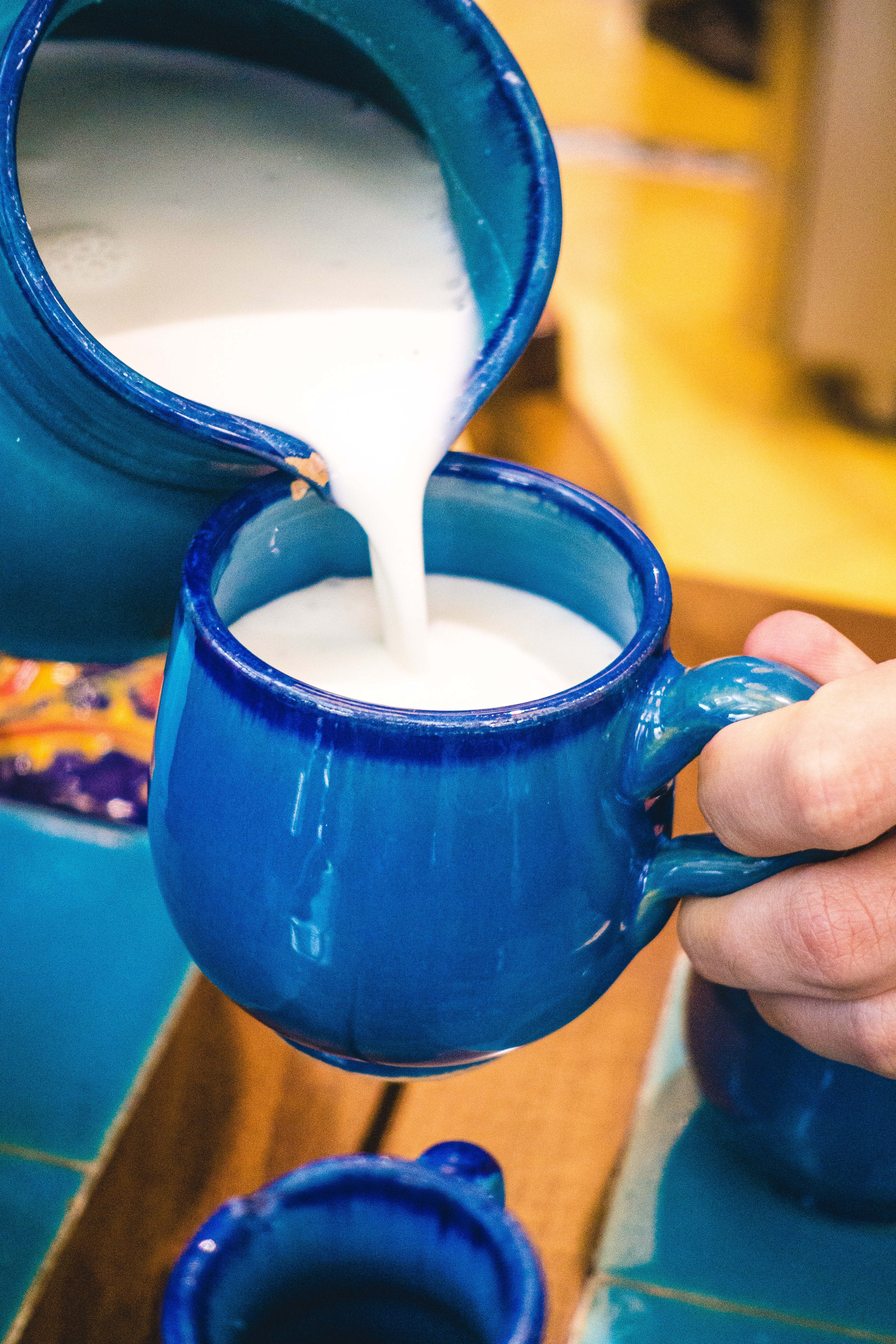Pouring traditional Iranian yogurt drink Doogh