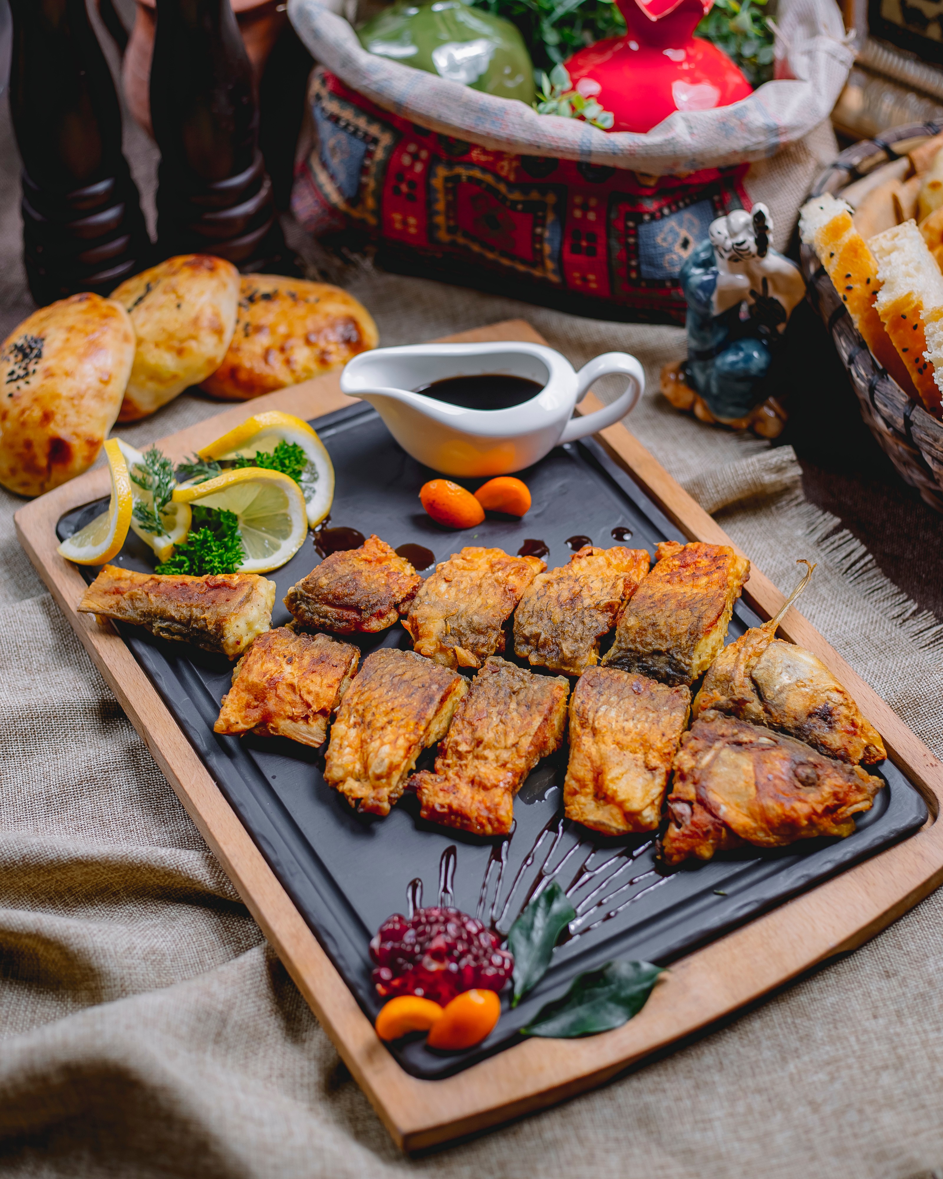 Side view grilled fish with lemon pomegranate sauce