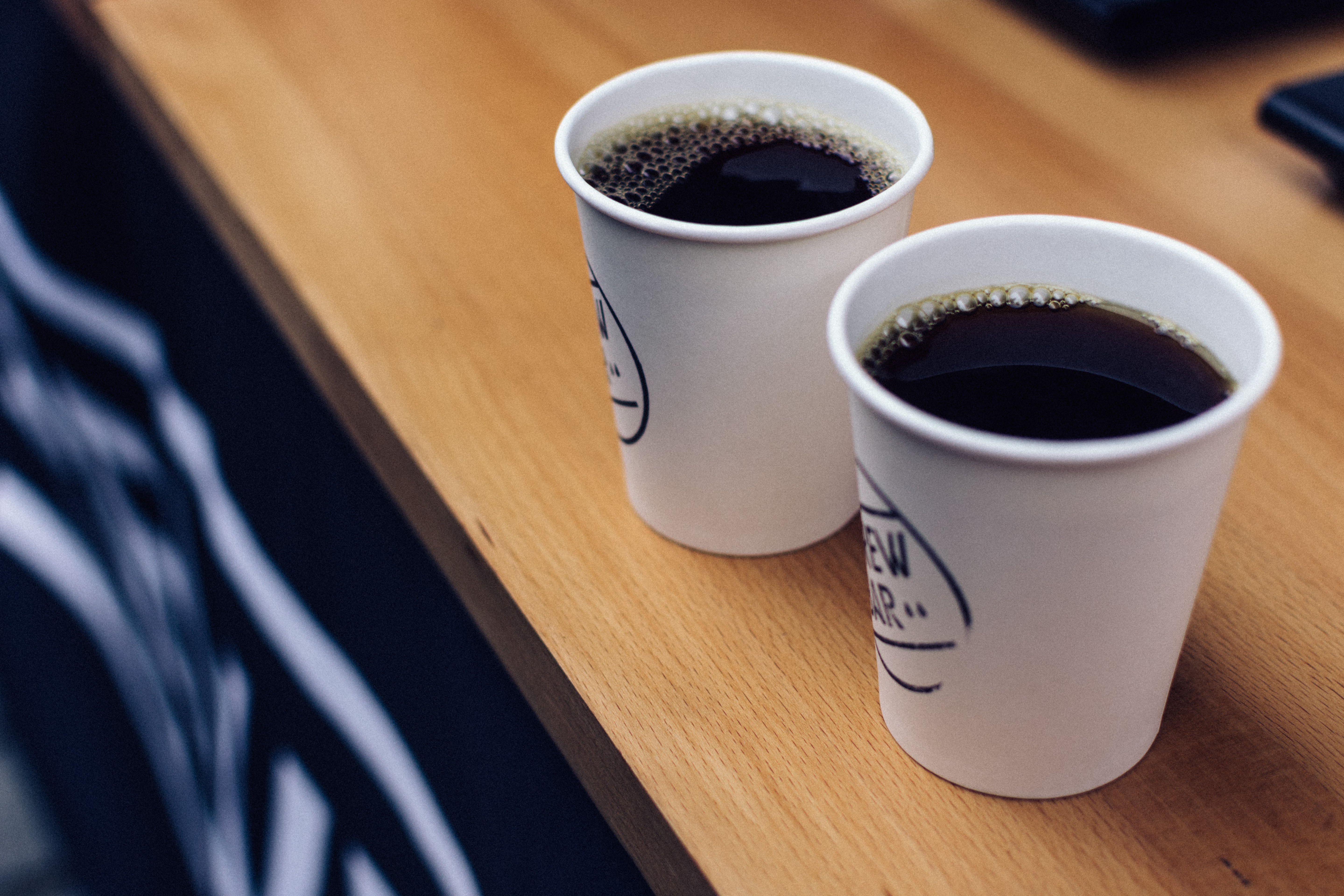 Two takeaway cups of filtered coffee