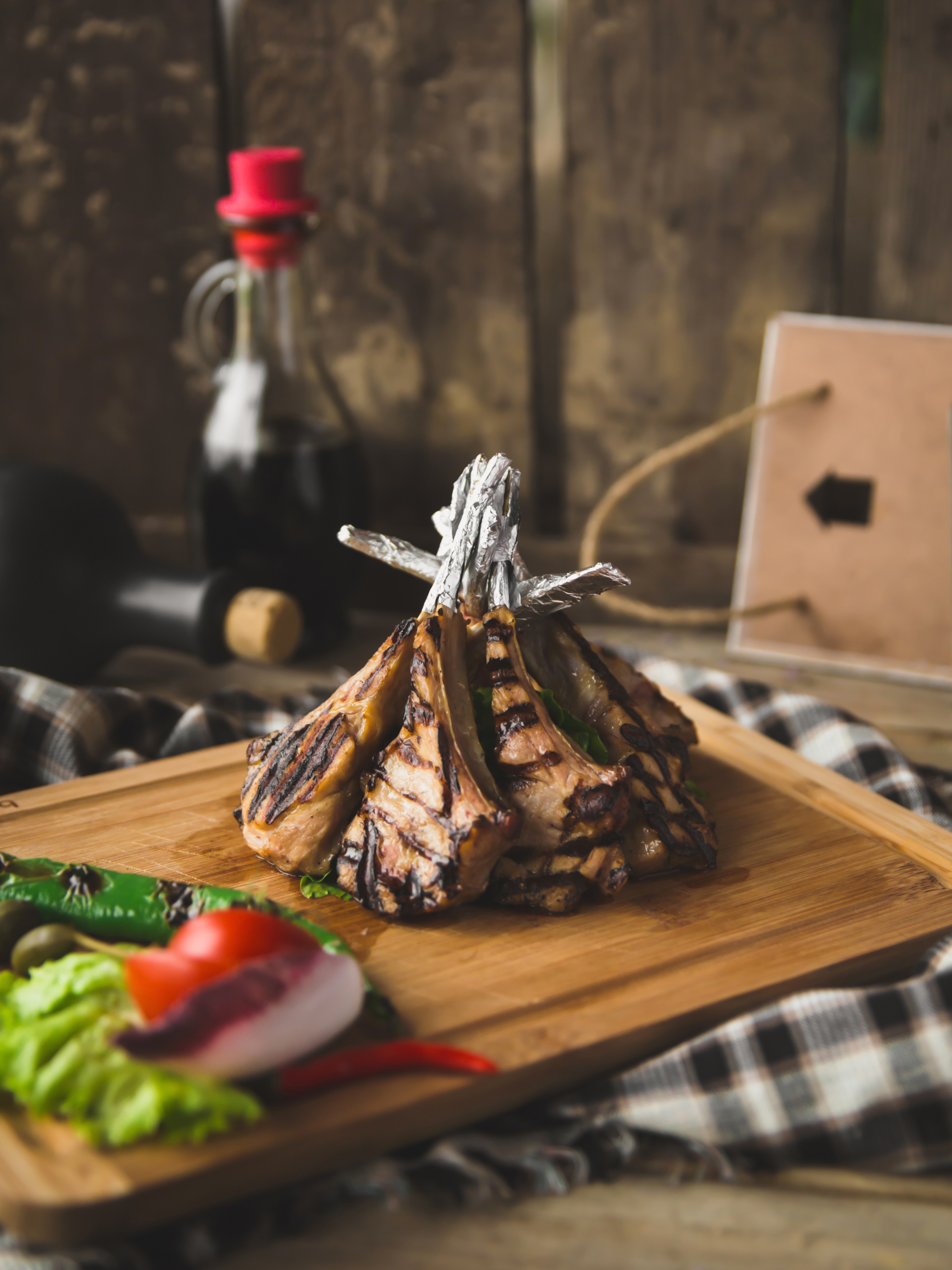 Wooden plate with lamb ribs